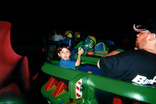 ian on the buzz lightyear ride, his favorite, magic kingdom